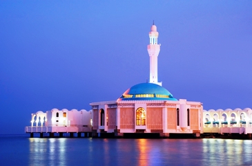 The Mercy (Al-Rahmah) Mosque is a beautiful example of modern Islamic architecture in the ancient city of Jeddah, Saudi Arabia.  It is built on the corniche (in Arabia ... a headland at land's end) of Jeddah above the Red Sea.  Photo is by "llmarry" and is used courtesy of the GNU Free Documentation 1.2 License.  (http://commons.wikimedia.org/wiki/File:MOSQUE-ON-WATER_edit.jpg)